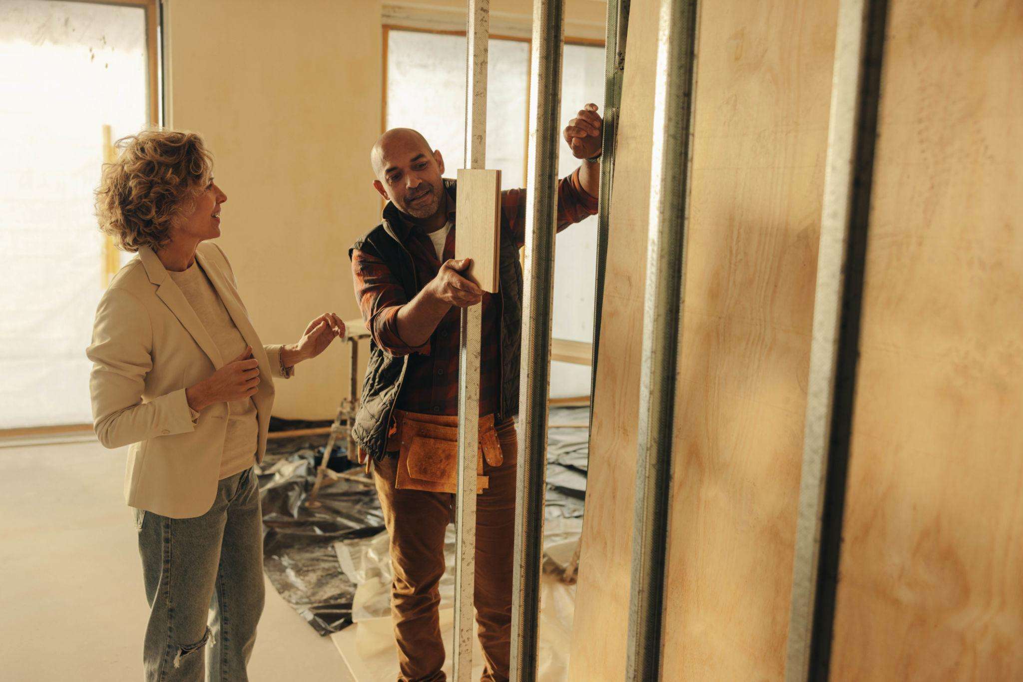 Homeowners meeting with a renovation contractor